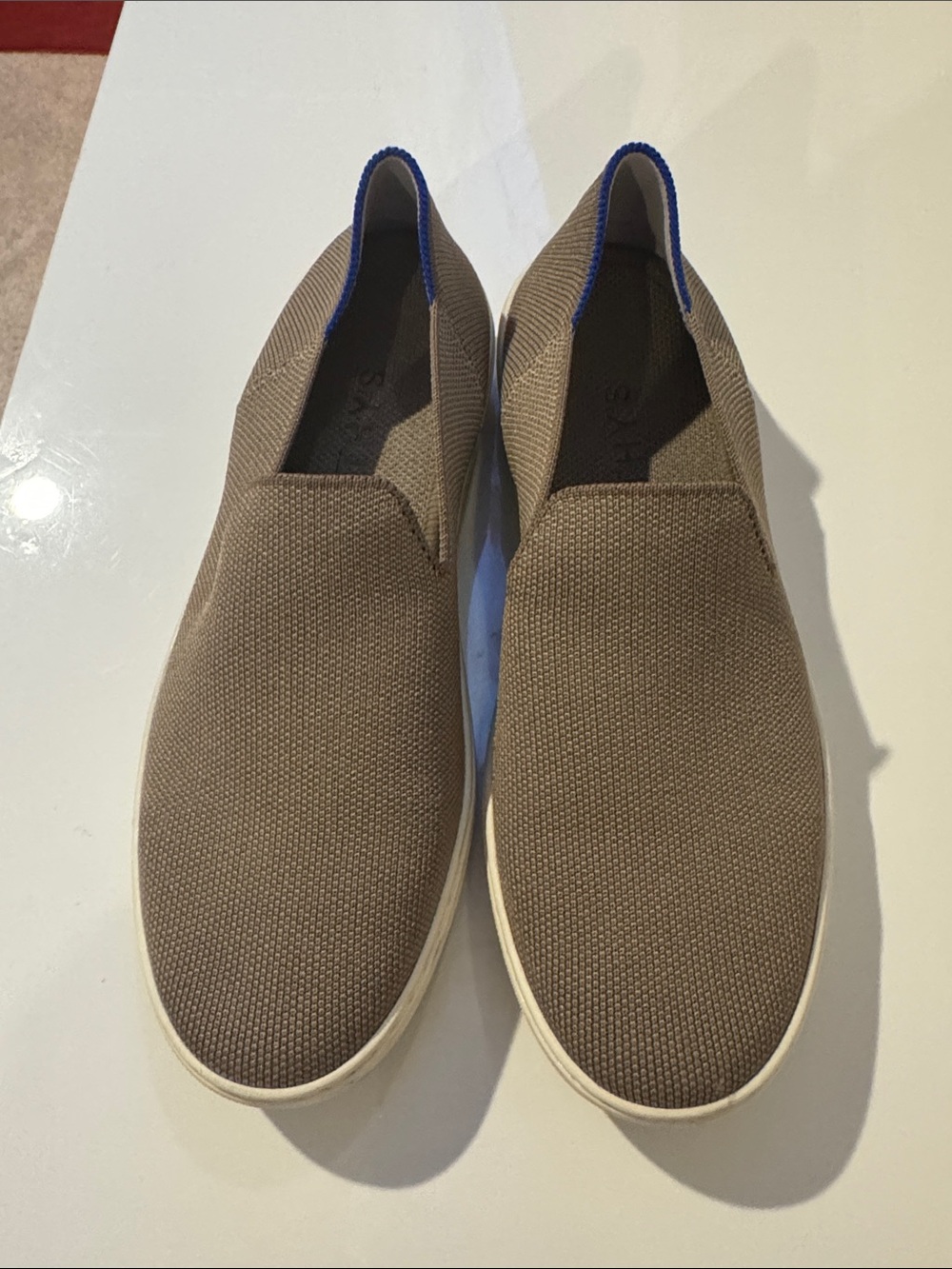 Rothy's Slip-On Sneakers in Taupe with Blue Trim